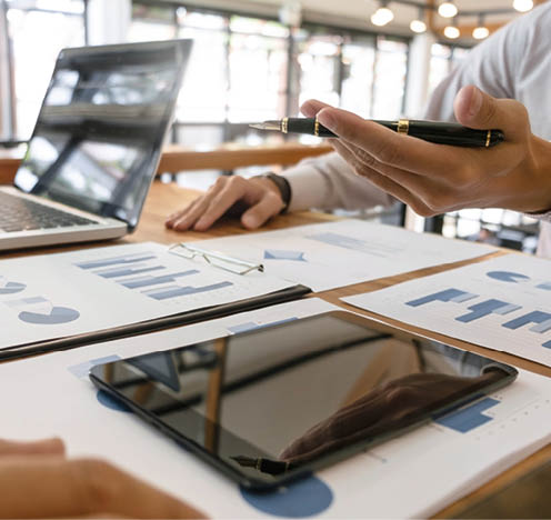 Business man analysis data document with accountant calculating about fee tax at a office